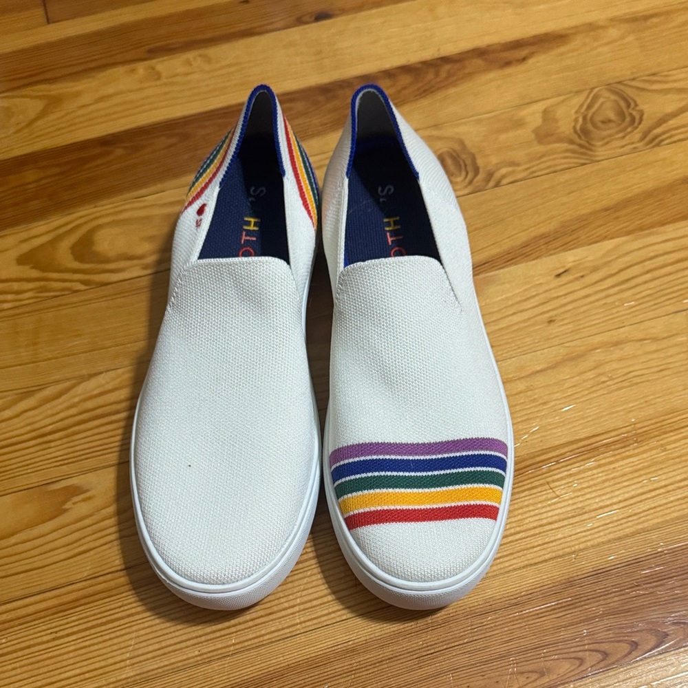 Rothy's White Slip-On Sneakers with Rainbow Stripes